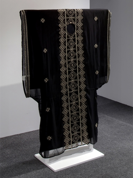 A hybrid of a traditional Kuwaiti dress with Palestinian cross stitch.